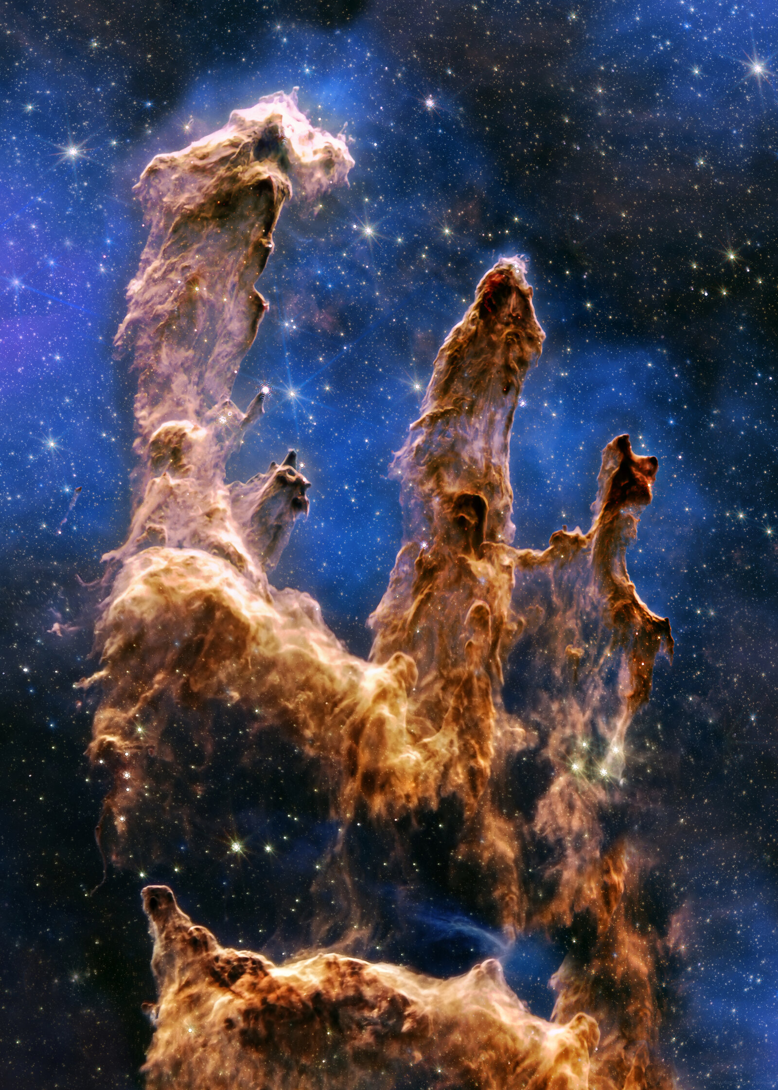 The Pillars of Creation (Eagle Nebula, M16) — JWST NIRCam and MIRI composite, showing gas and dust columns where new stars are forming