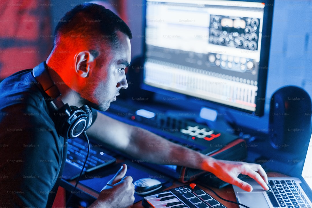 Guy have a job with project and mixing music indoors in the studio.
