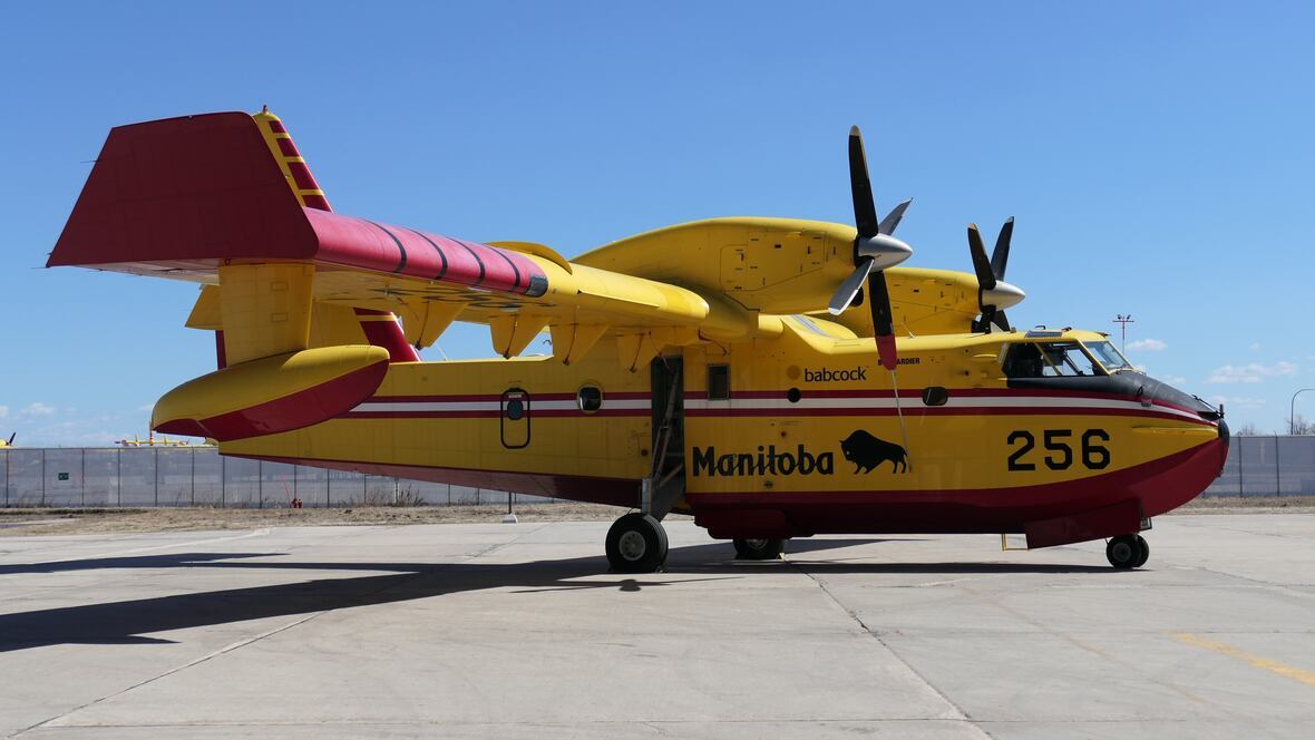 Water bomber aircraft dropping retardant on Canadian wildfire, 2026